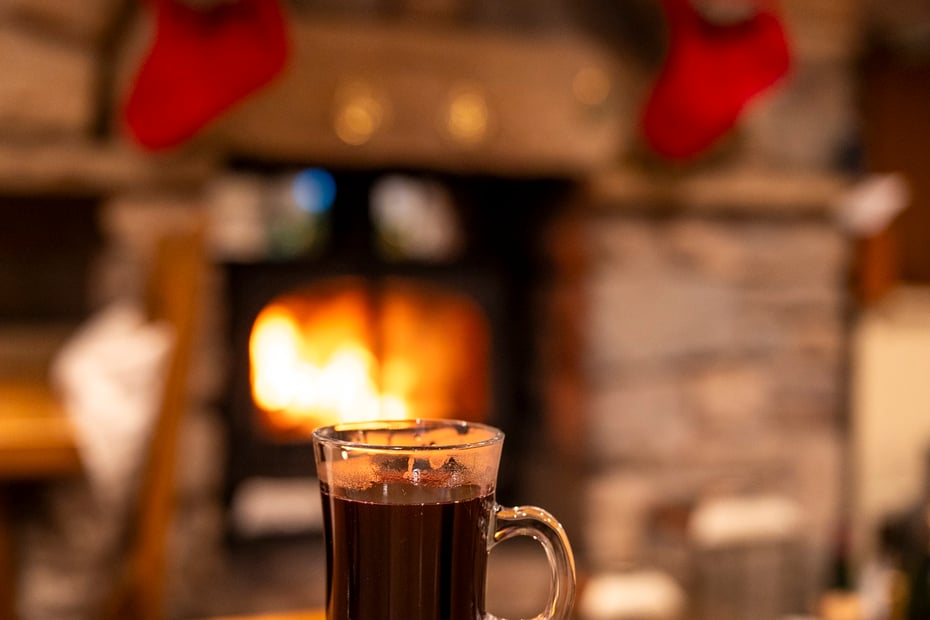 Christmas events in the Lake District. Mulled wine on the table and stockings behind