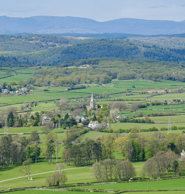 Field Broughton and the surrounding country side in the Lake District. St Peter's church in the centre, surrounded by fields