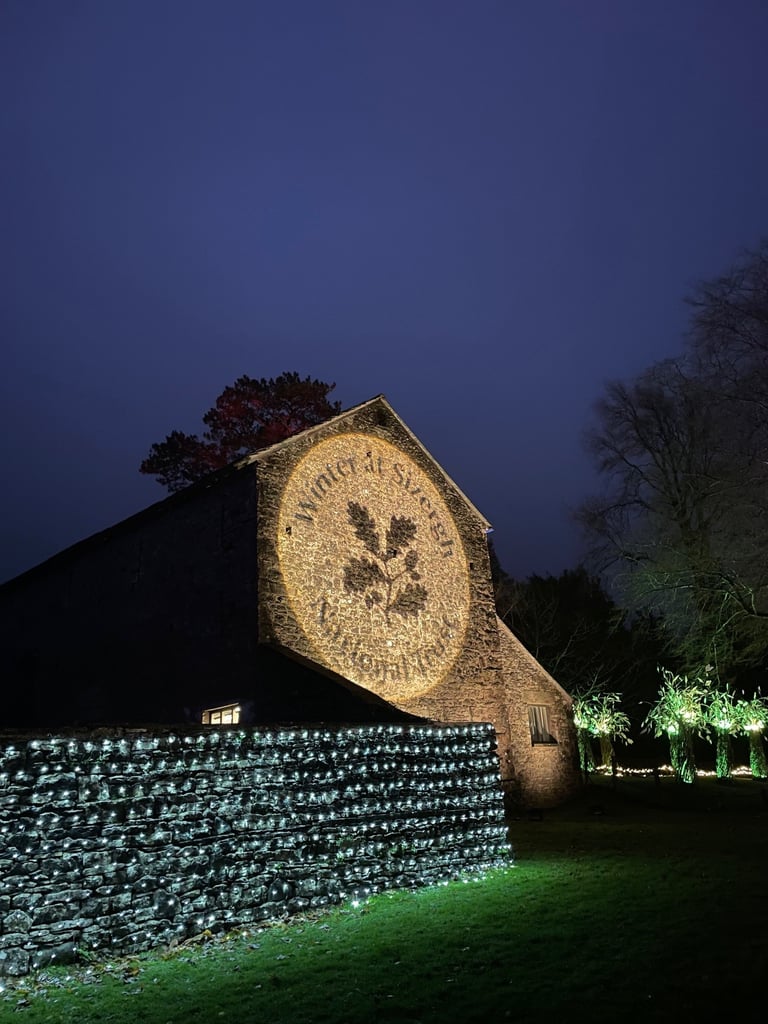 National Trust projected on the barn wall at Sizergh Castle in the Lake District as part of the Winter Lights.