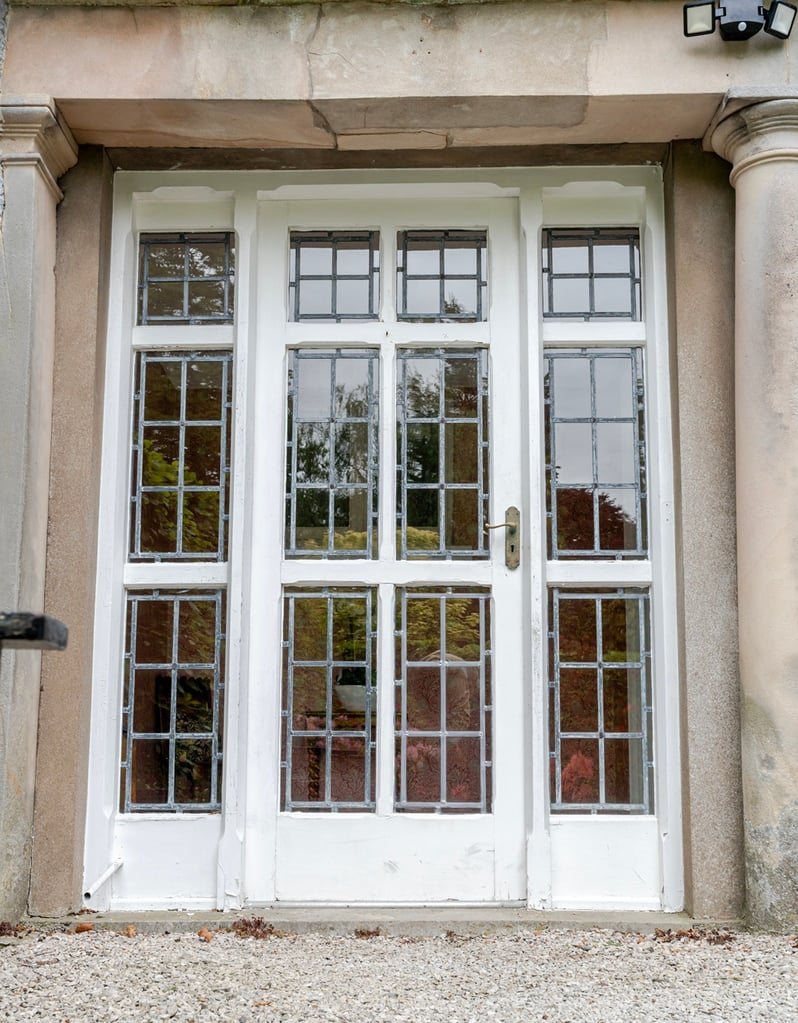 The front door and gravel driveway