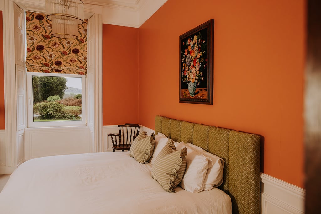 The superking bed set up in the second bedroom with garden views