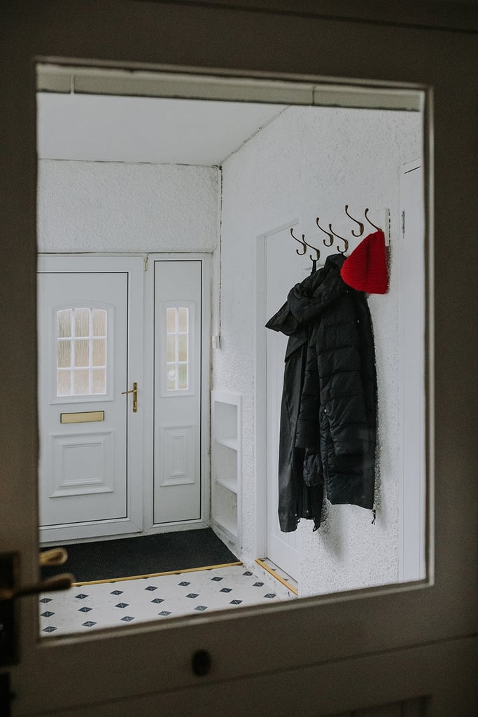 The boot room at the Pheasant lodge with coat hanging up