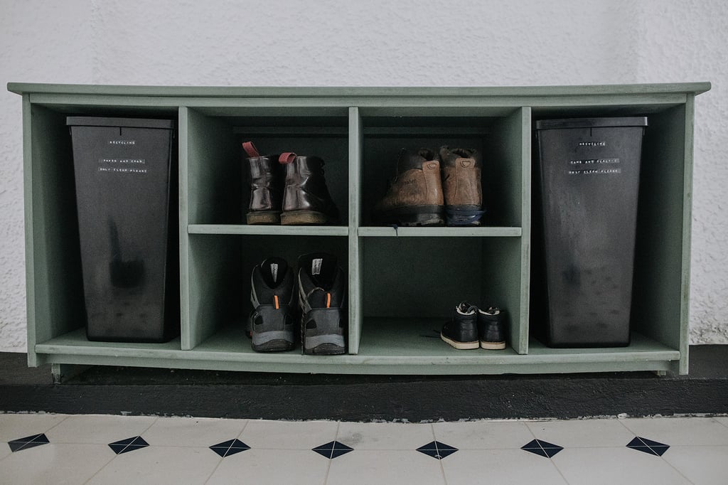 Boots in boxes in the boot room at the Pheasant Lodge
