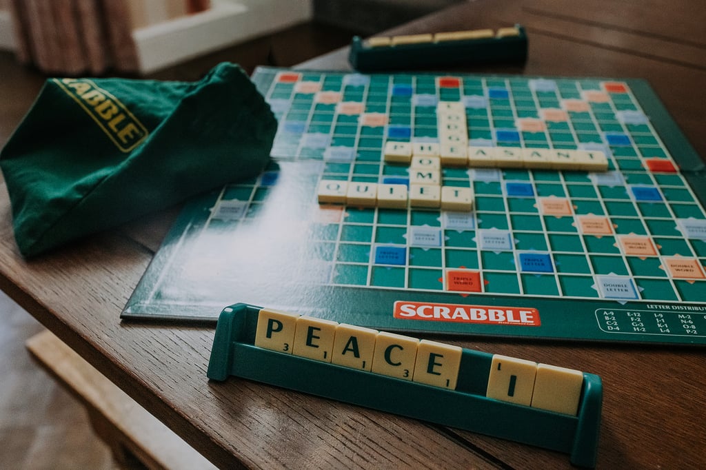 Scrabble board and letter tiles on the dining table at The Pheasant Lodge